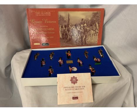 A BOXED BRITIANS SCOTS GUARDS BAND OF THE PIPES AND DRUMS 1899 MODEL SOLDIER SET NUMBER 00214 
