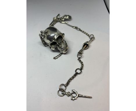 A HEAVY SILVER ALBERT CHAIN WITH LARGE SKULL FOB AND BONE, HAND ETC DESIGN 