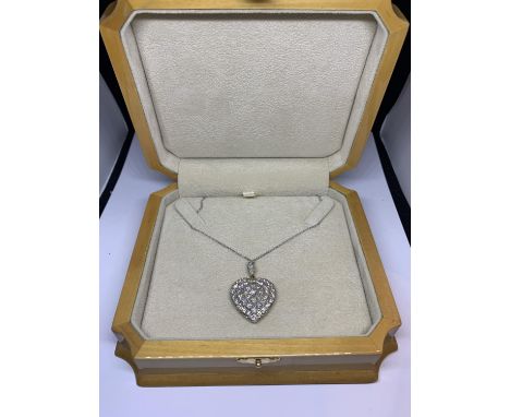 A 15 CARAT WHITE AND YELLOW GOLD LARGE DIAMOND ENCRUSTED HEART PENDANT WITH CHAIN LENGTH 44CM IN A PRESENTATION BOX 