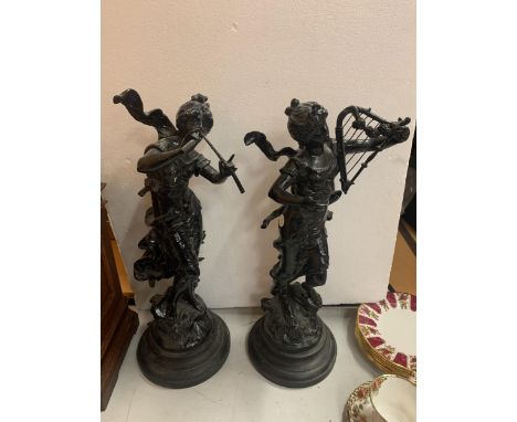 TWO RESIN FIGURINES ON A WOODEN BASES OF LADIES PLAYING MUSICAL INSTRUMENTS 51CM TALL 
