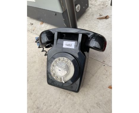 A RETRO BLACK ROTARY DIAL WALL MOUNTED TELEPHONE 