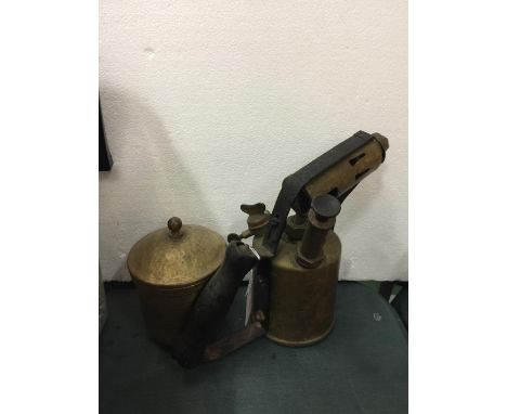 A BRASS BLOW LAMP AND A BRASS LIDDED POT 