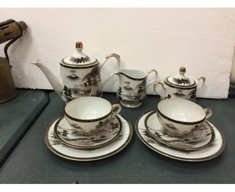 AN ORIENTAL TEASET COMPRISING OF CUPS, SAUCERS, SIDE PLATES, TEAPOT, MILK JUG AND SUGAR BOWL. 