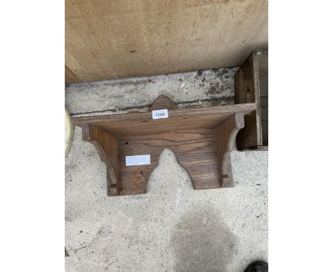 A SOLID OAK SHELF RECLAIMED FROM A CHURCH 