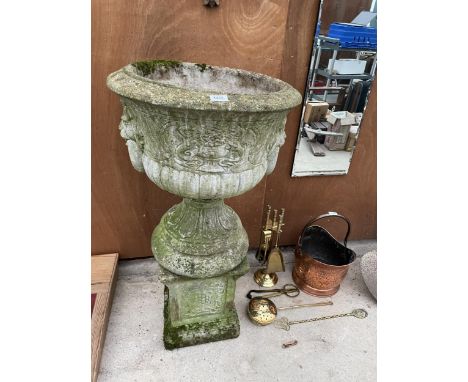 A RECONSTITUTED STONE URN PLANTER ON PEDASTEL BASE WITH LIONS HEAD DECORATION 