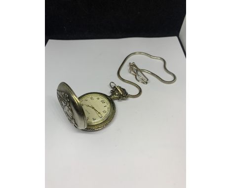 A CHROME POCKET WATCH ON A CHAIN WITH STEAM TRAIN DECORATION IN A PRESENTATION BOX 