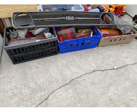 AN ASSORTMENT OF AUTOMOBILE SPARES TO INCLUDE LIGHT COVERS AND A GRILL FROM A FORD 