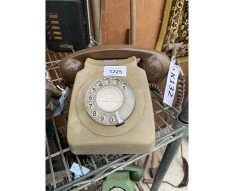 A RETRO BROWN ROTARY DIAL TELEPHONE 