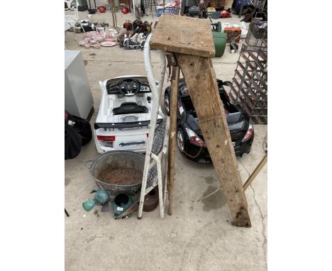 A VINTAGE GALVANISED BATH, A METAL WATERING CAN AND A DOG PLANTER 