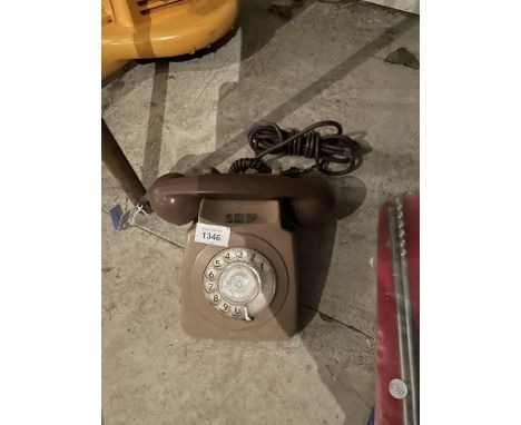 A RETRO BROWN ROTARY DIAL TELEPHONE 