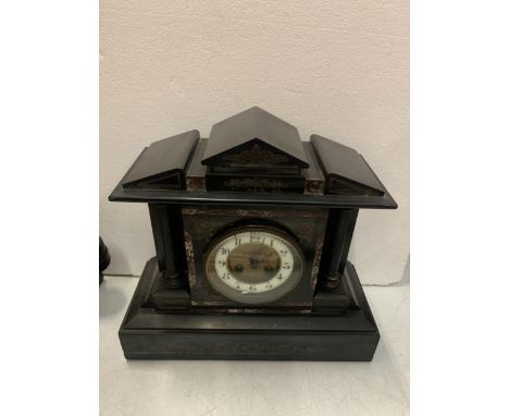 A SLATE MANTLE CLOCK WITH COLUMNS AND A FRENCH MOVEMENT 