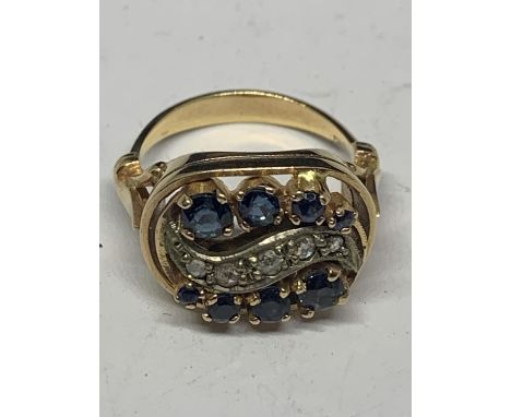 A 14 CARAT YELLOW GOLD RING WITH SAPPHIRES AND DIAMONDS IN A DECO STYLE SETTING GROSS WEIGHT 6 GRAMS SIZE N WITH A PRESENTATI