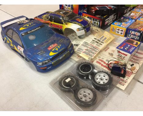 VARIOUS RC MODEL CAR SPARES - A SUBARU BODY, PICK UP BODY, DECALS, TRAXXAS ELECTRONIC SPEED CONTROLL, WHEELS ETC 