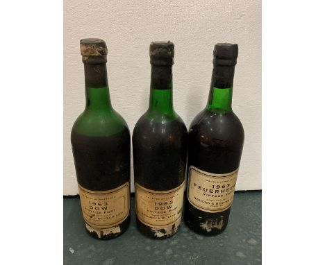 THREE BOTTLES OF HEDGES &amp; BUTLER LTD 1963 VINTAGE PORT TO INCLUDE DOW AND FEUERHEERD 