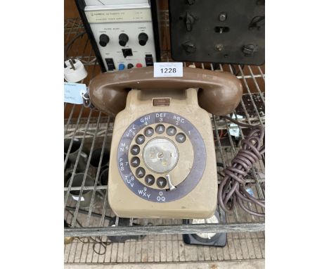 A RETRO BROWN ROTARY DIAL TELEPHONE 