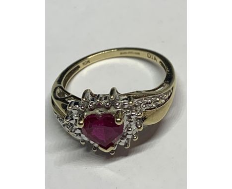A 9 CARAT GOLD RING WITH A HEART SHAPED RUBY SURROUNDED BY DIAMONDS WITH DIAMONDS ON THE SHOULDERS SIZE K/L IN A PRESENTATION