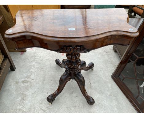 A VICTORIAN WALNUT SERPENTINE FOLD-OVER CARD TABLE ON QUATREFOIL BASE, 35" WIDE 