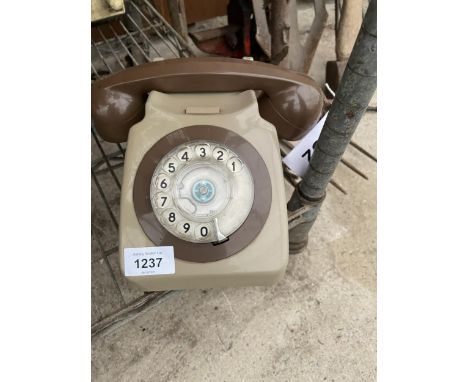 A RETRO BROWN ROTARY DIAL TELEPHONE 