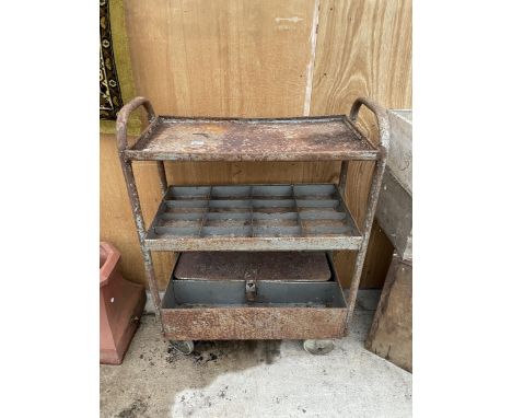 A VINTAGE FOUR WHEELED WORKSHOP TROLLEY WITH UPPER SHELF, LOCK BOX AND SECTIONAL SHELF 