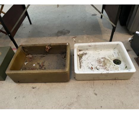 A BROWN SALT GLAZED TROUGH AND A FURTHER WHITE BELFAST SINK 