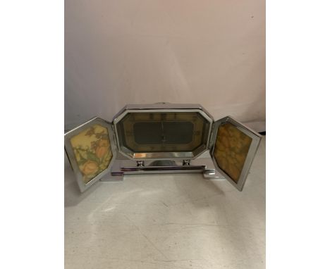 AN UNUSUAL ART DECO STYLE CHROME CLOCK WITH FOLDING PHTOGRAPH FRAME FACE COVER 
