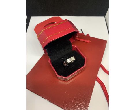 A FASHION LOVE RING SIZE P GROSS WEIGHT 5.69 GRAMS WITH A PRESENTATION BOX AND GIFT BAG 