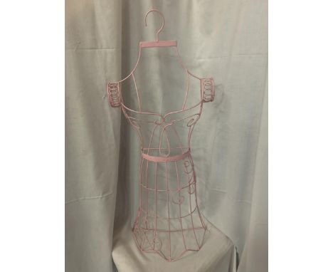 A PINK WIRE HANGING MANNEQUIN 
