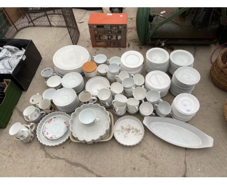 A LARGE COLLECTION OF CERAMIC WARE TO INCLUDE MUGS, PLATES AND CUPS AND SAUCERS ETC 