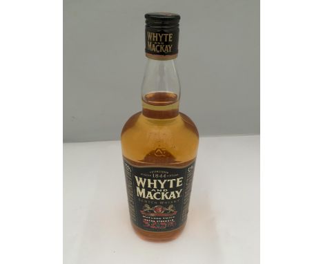 A 1 LITRE BOTTLE OF WHYTE AND MACKAY SCOTCH WHISKY MATURED TWICE EXTRA STRENGTH 52.5% VOLUME 