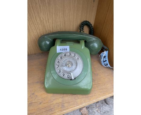 A RETRO GREEN ROTARY DIAL TELEPHONE 