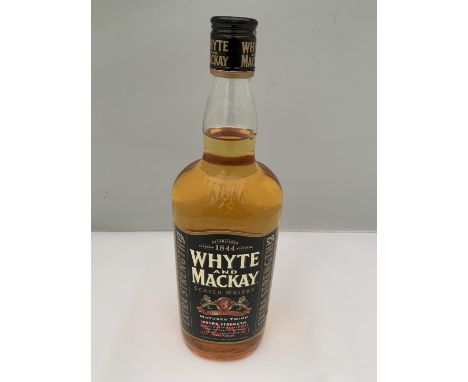 A 1 LITRE BOTTLE OF WHYTE AND MACKAY SCOTCH WHISKY MATURED TWICE EXTRA STRENGTH 52.5% VOLUME 
