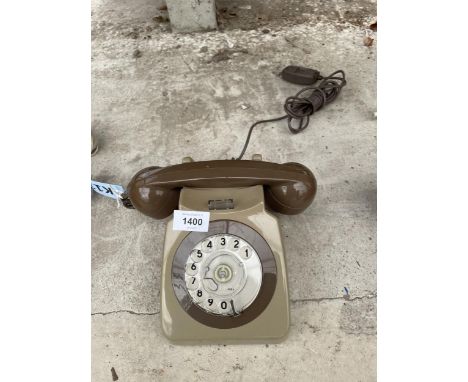 A RETRO BROWN ROTARY DIAL TELEPHONE 