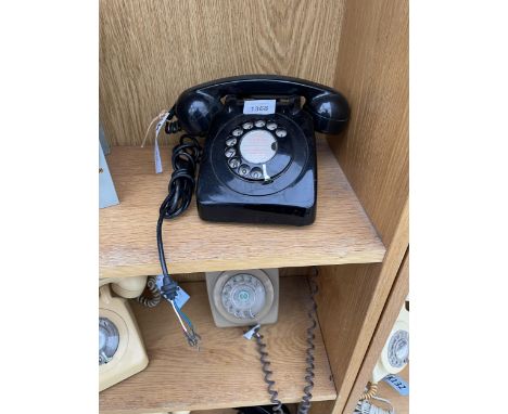 A RETRO BLACK ROTARY DIAL TELEPHONE 