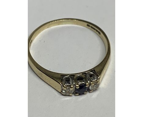 A 9 CARAT GOLD RING WITH A CENTRAL SAPPHIRE AND A DIAMOND EACH SIDE SIZE K/L IN A PRESENTATION BOX 