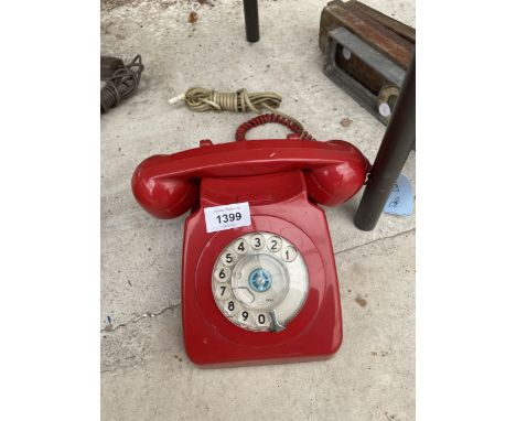 A RETRO RED ROTARY DIAL TELEPHONE 