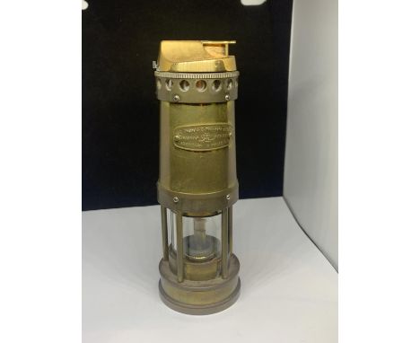 A LARGE LIGHTER IN THE FORM OF A MINERS LAMP 
