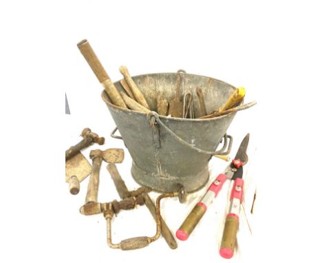 Large coal bucket filled with assorted vintage tools 