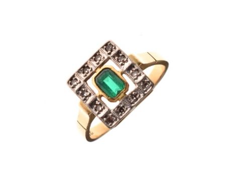 Yellow metal ring set central green stone within a surround of twelve white stones, the shank stamped 18ct, size K, 3.5g appr