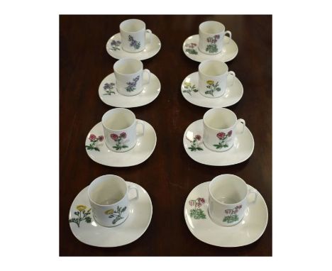 Set of eight Limoges coffee cans and saucers, each having botanic decoration   Condition: 