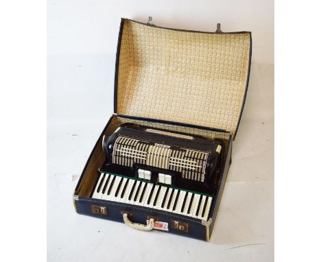 Mid 20th Century cased accordion by Maestro, with 120 buttons and black body in case   Condition: 
