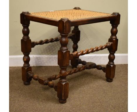 Early 20th Century beech dressing stool having a split cane seat and standing on turned supports united by barley twist stret