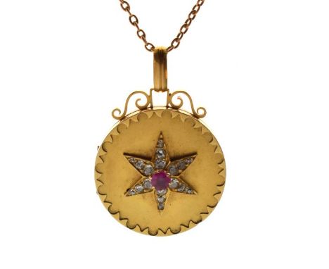 Satin finish yellow metal locket having star decoration in relief set diamonds and central pink stone, stamped 18, the fine n