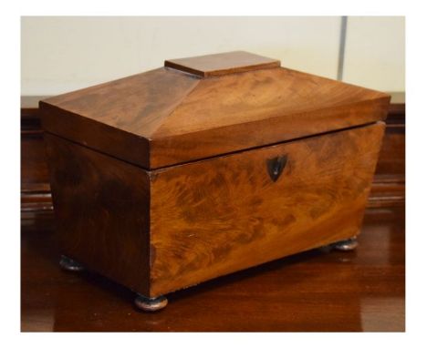 19th Century mahogany sarcophagus shaped tea caddy, the hinged cover opening to reveal a fitted interior with two boxes and a