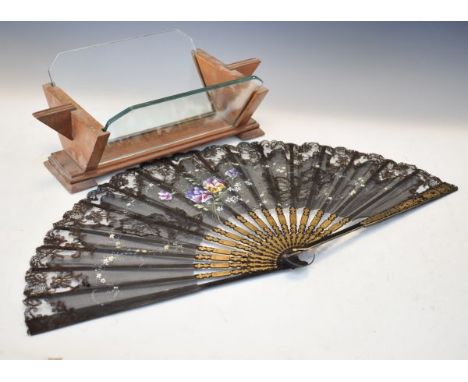 Art Deco teak plate glass book trough, together with a decorative fan   Condition: 