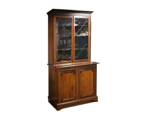 Edwardian mahogany two section bookcase, the upper section fitted four shelves enclosed by a pair of astragal glazed doors, t