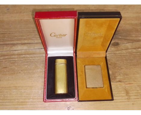 A vintage Cartier gold plated textured lighter in box & a vintage Dupont gold plated textured lighter with box.Condition:- Ge