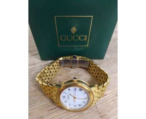 A Gucci Sapphire ladies quartz watch, with additional links for strap / bracelet, in box. Condition:- general wear through ag