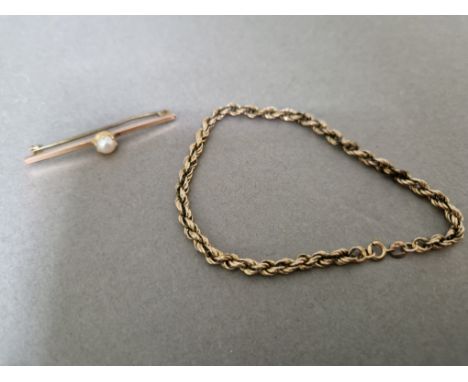 A 9ct gold twist bracelet together with a 9ct gold brooch set with a central pearl, gross wt. 5.8g.