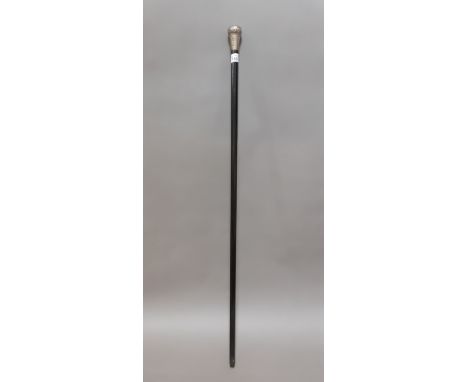 An ebonised wood and silver topped walking stick. 