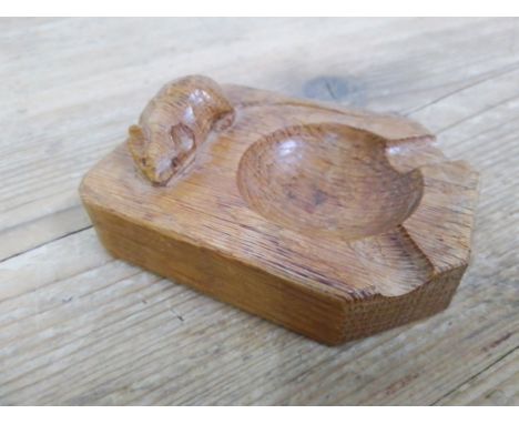 Robert "Mouseman" Thompson - an oak ashtray, rectangular form with canted corners, carved mouse signature, length 10.2cm. 